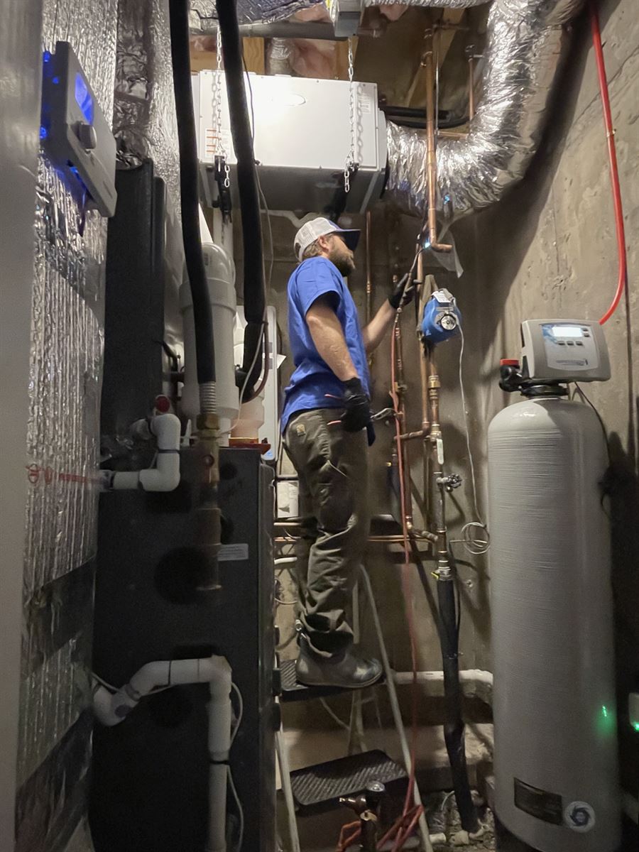 Technician soldering a copper fitting