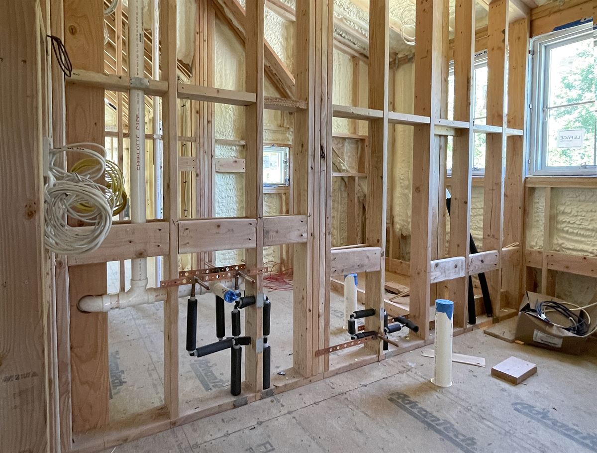 Rough-in plumbing at a new construction site