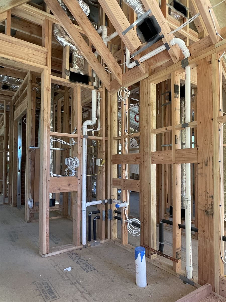 Rough-in supply and drain lines at a new construction site